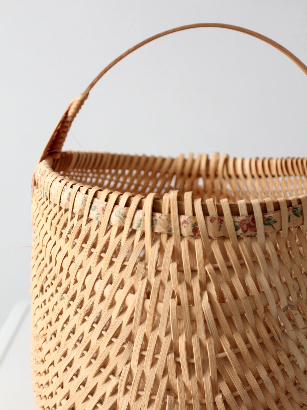vintage wicker buttocks basket with floral trim