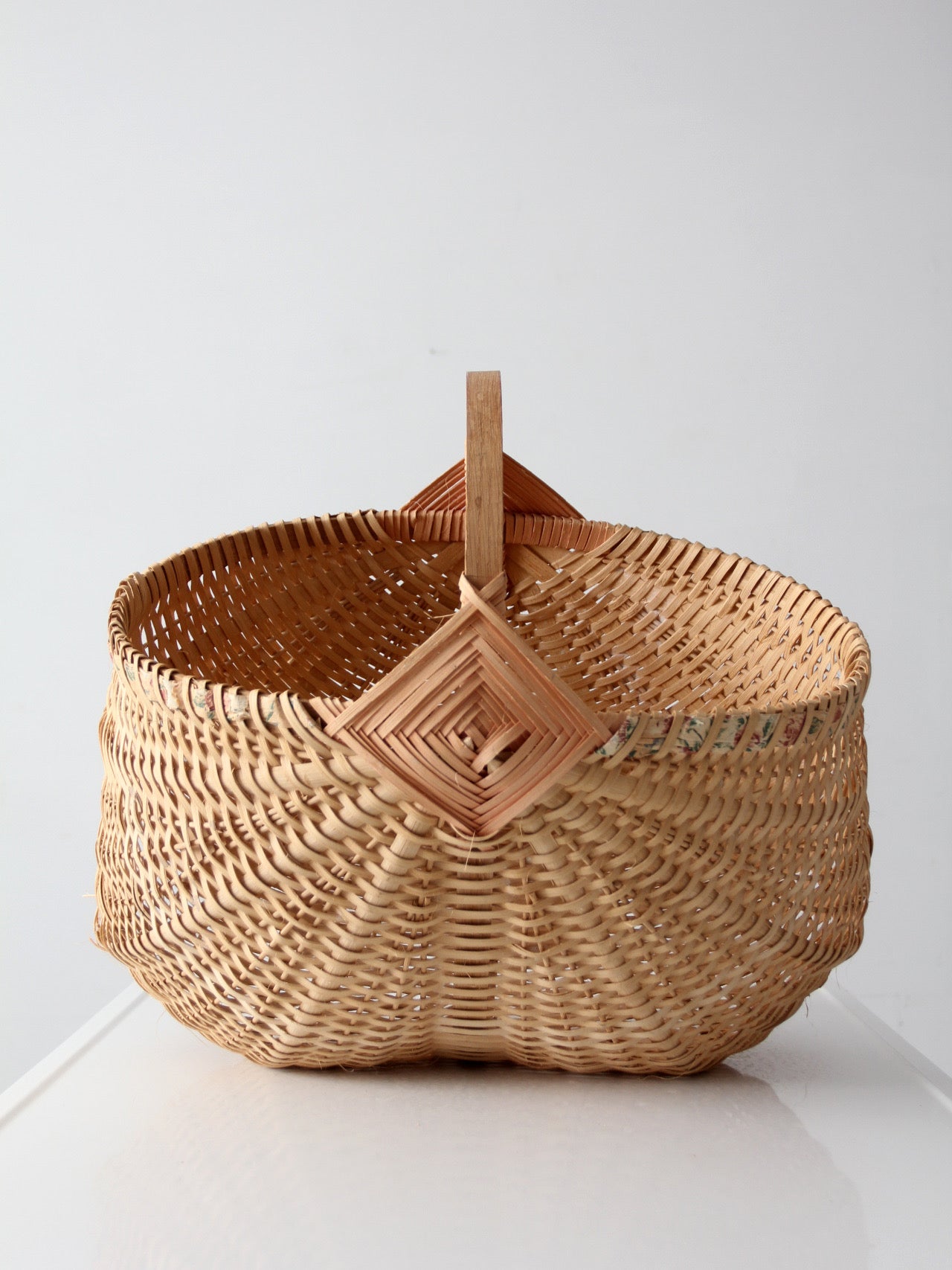 vintage wicker buttocks basket with floral trim