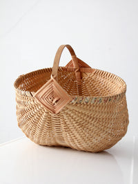 vintage wicker buttocks basket with floral trim