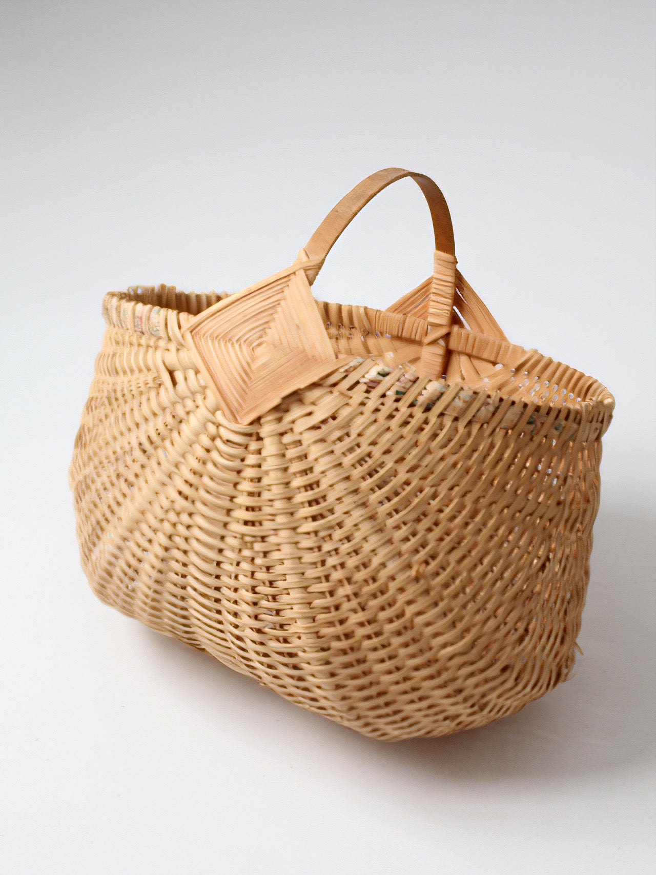 vintage wicker buttocks basket with floral trim