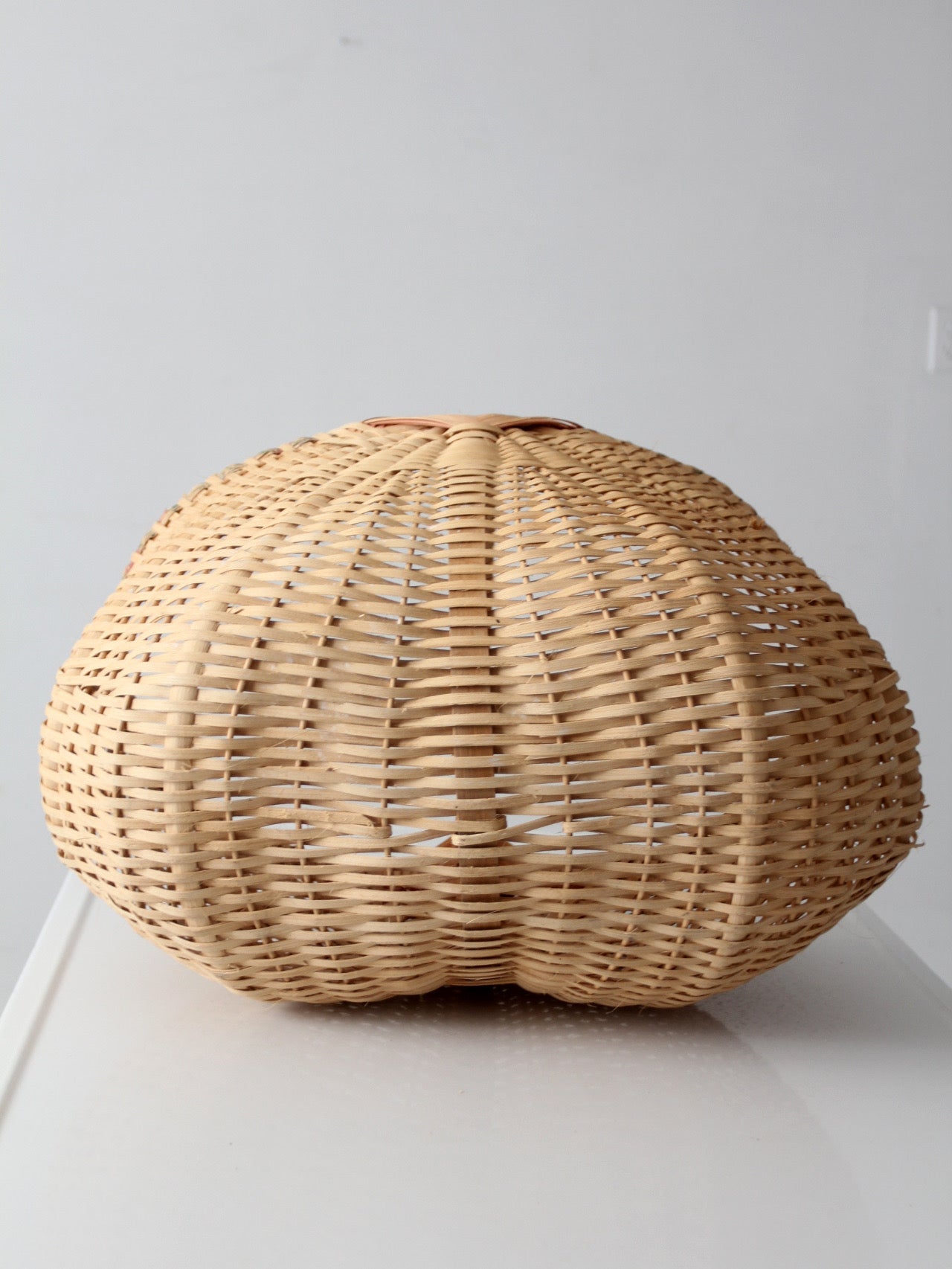 vintage wicker buttocks basket with floral trim