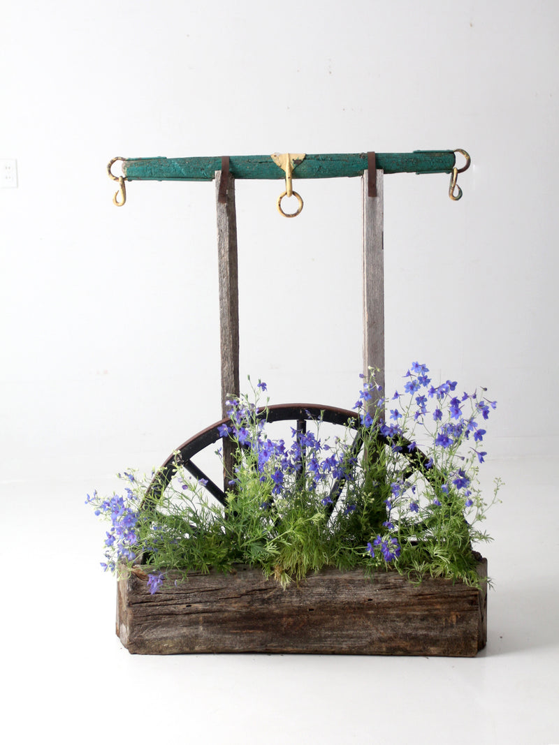 vintage folk art wagon wheel planter