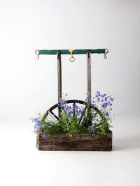 vintage folk art wagon wheel planter