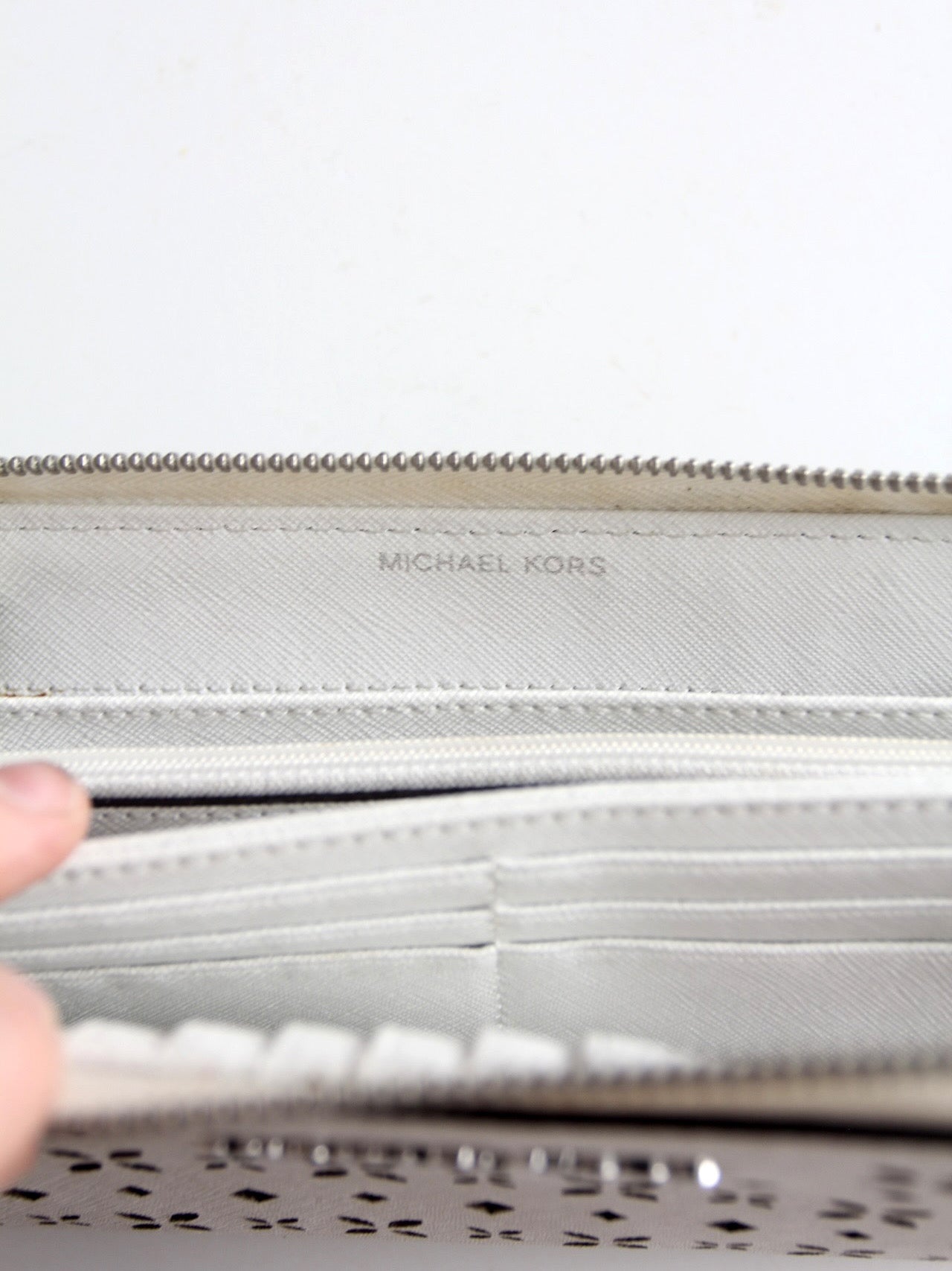 Michael Kors perforated zip around wallet