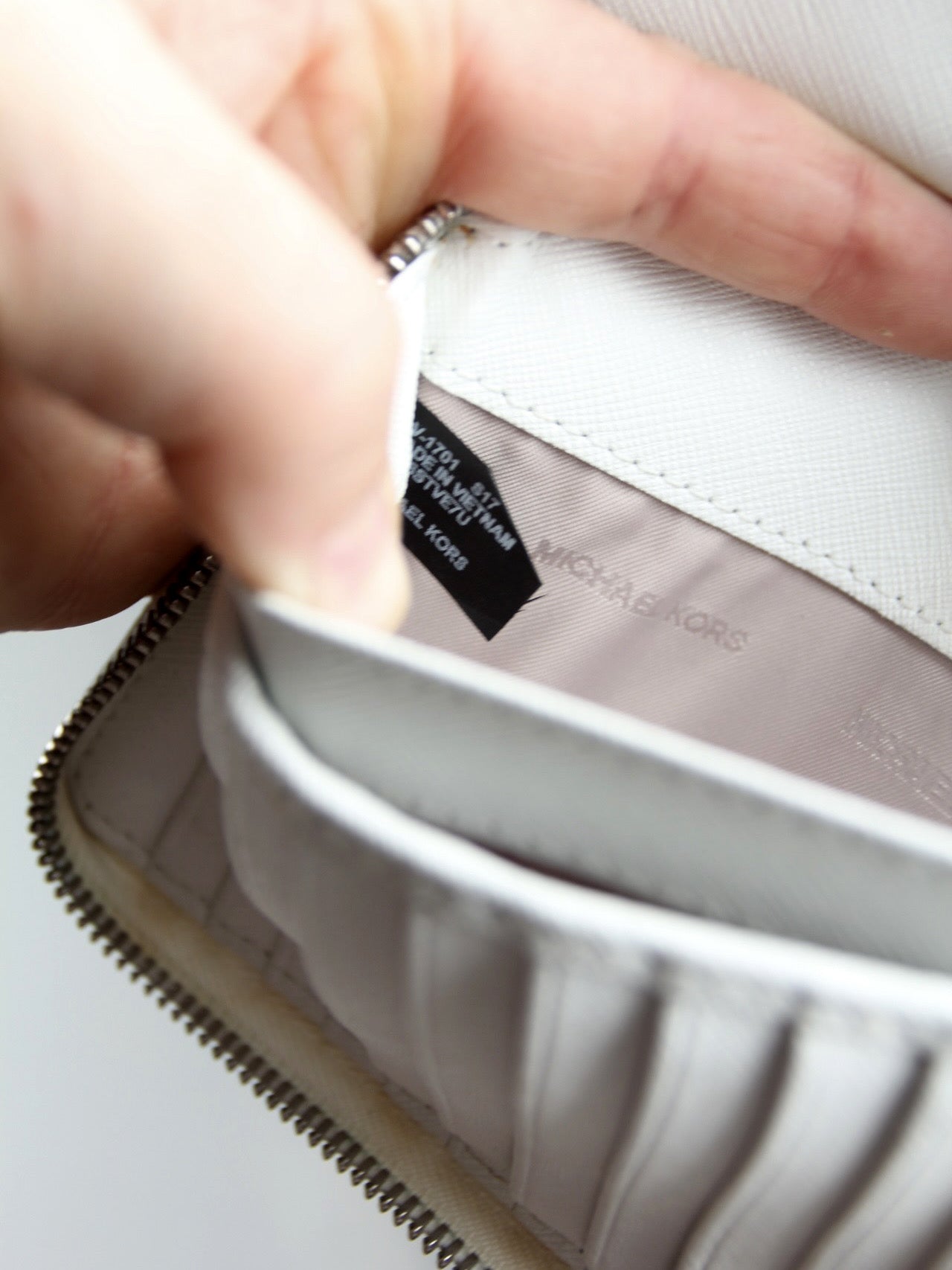 Michael Kors perforated zip around wallet