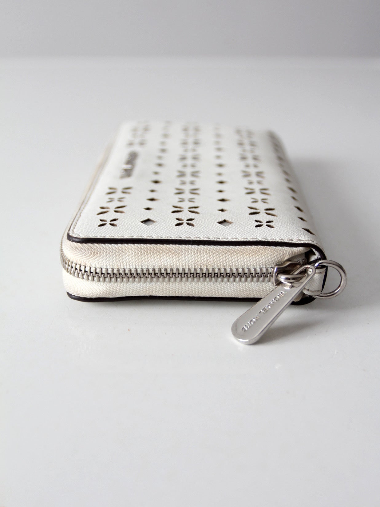 Michael Kors perforated zip around wallet