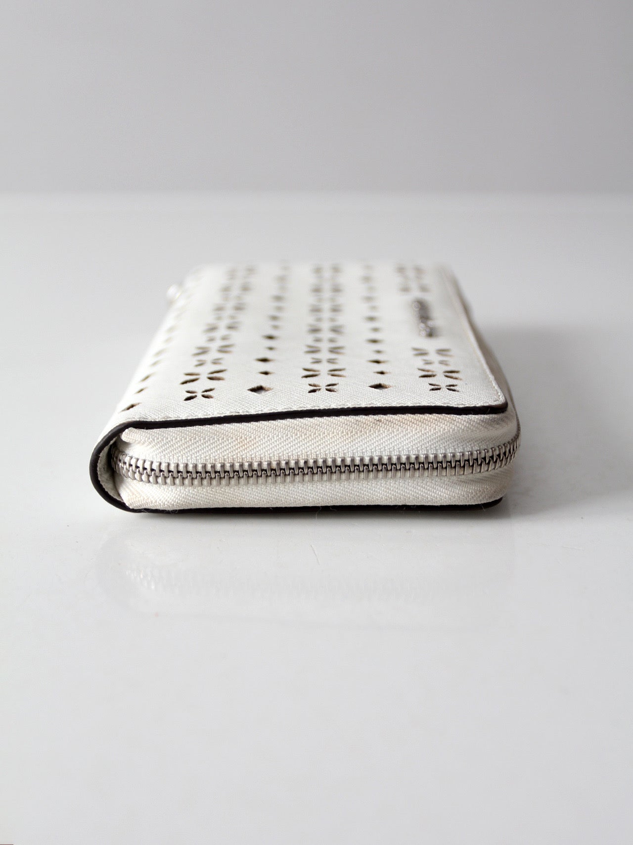 Michael Kors perforated zip around wallet