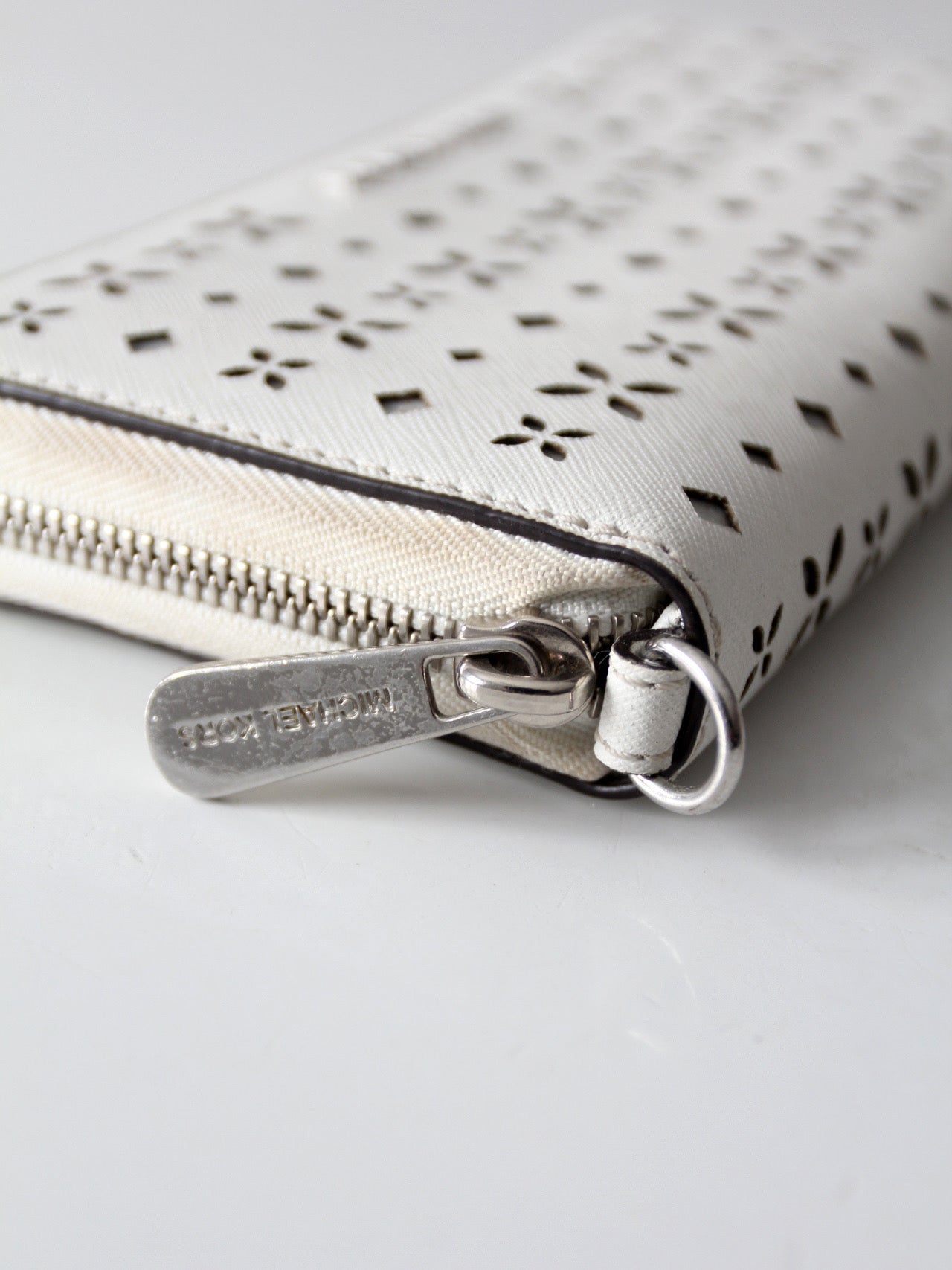 Michael Kors perforated zip around wallet