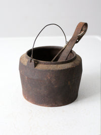 antique smelting pot and ladles