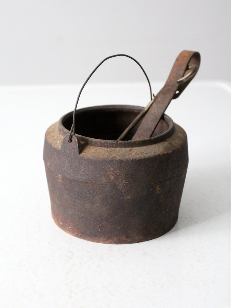antique smelting pot and ladles