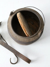 antique smelting pot and ladles