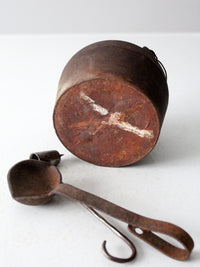 antique smelting pot and ladles