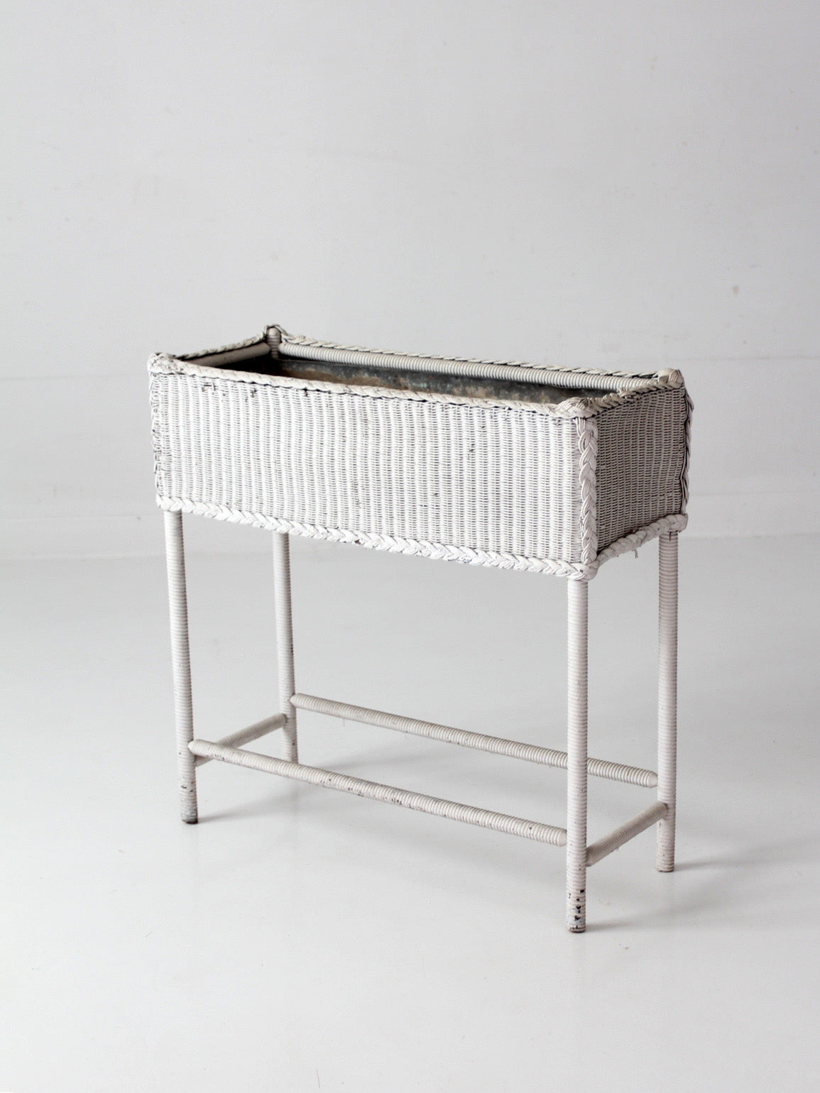antique white wicker plant stand with removable metal liner