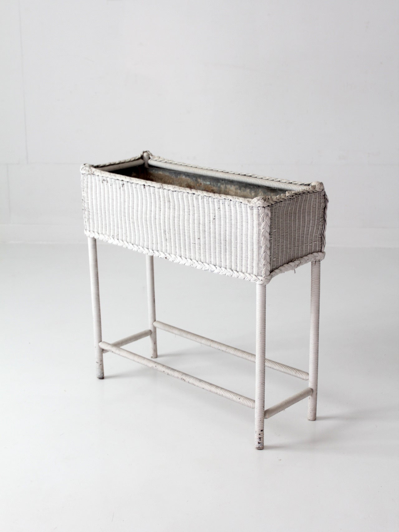 antique white wicker plant stand with removable metal liner