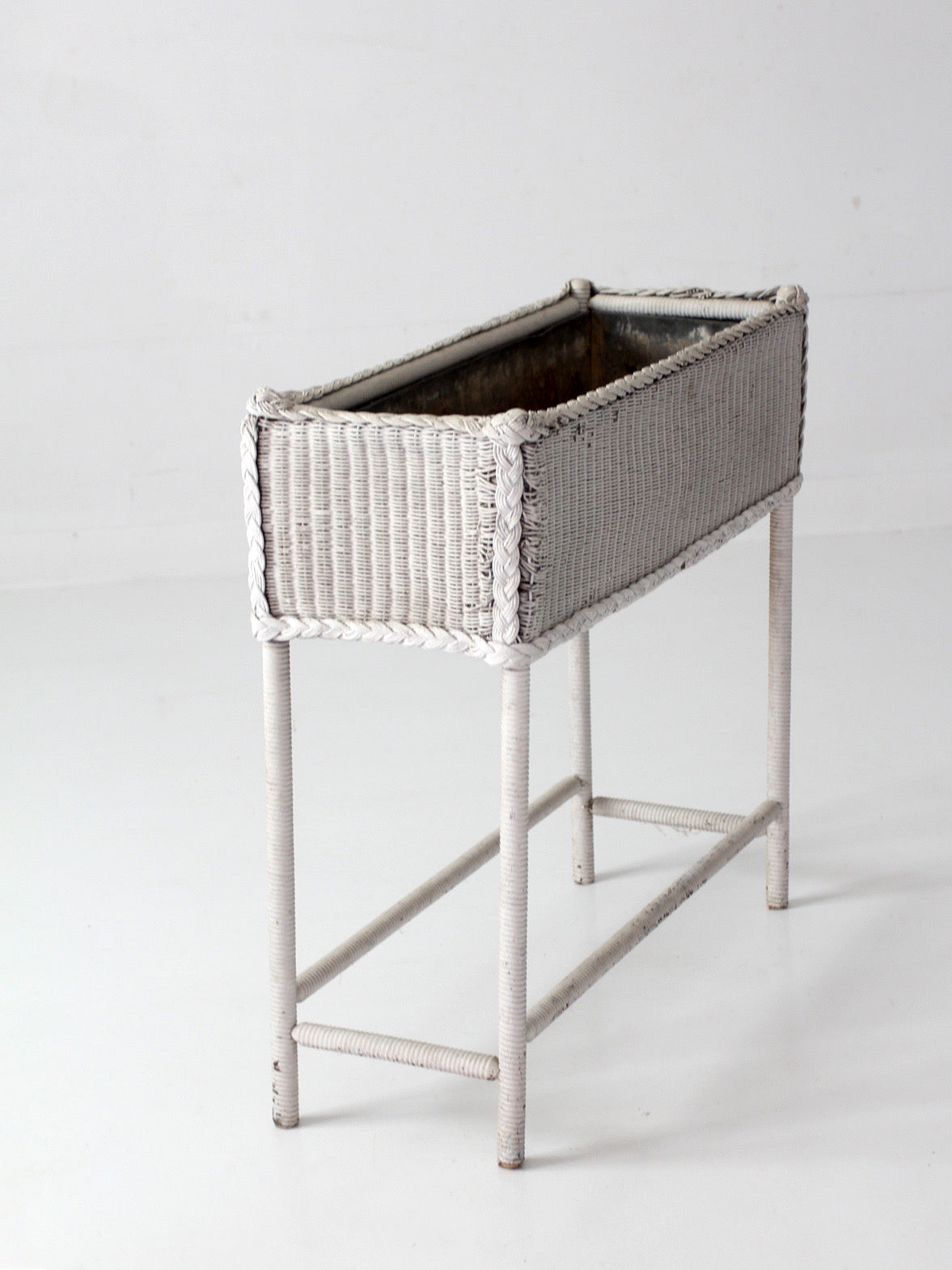 antique white wicker plant stand with removable metal liner