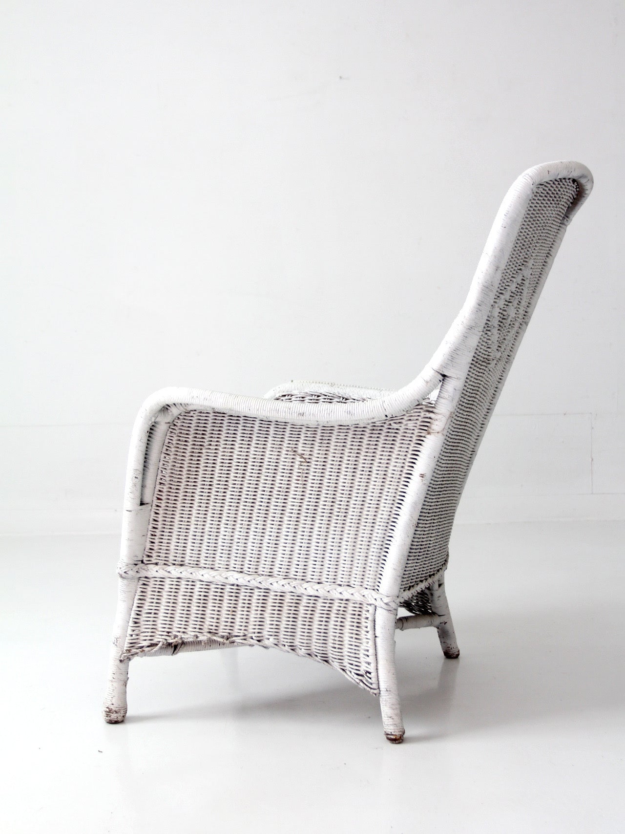 antique white wicker porch chair