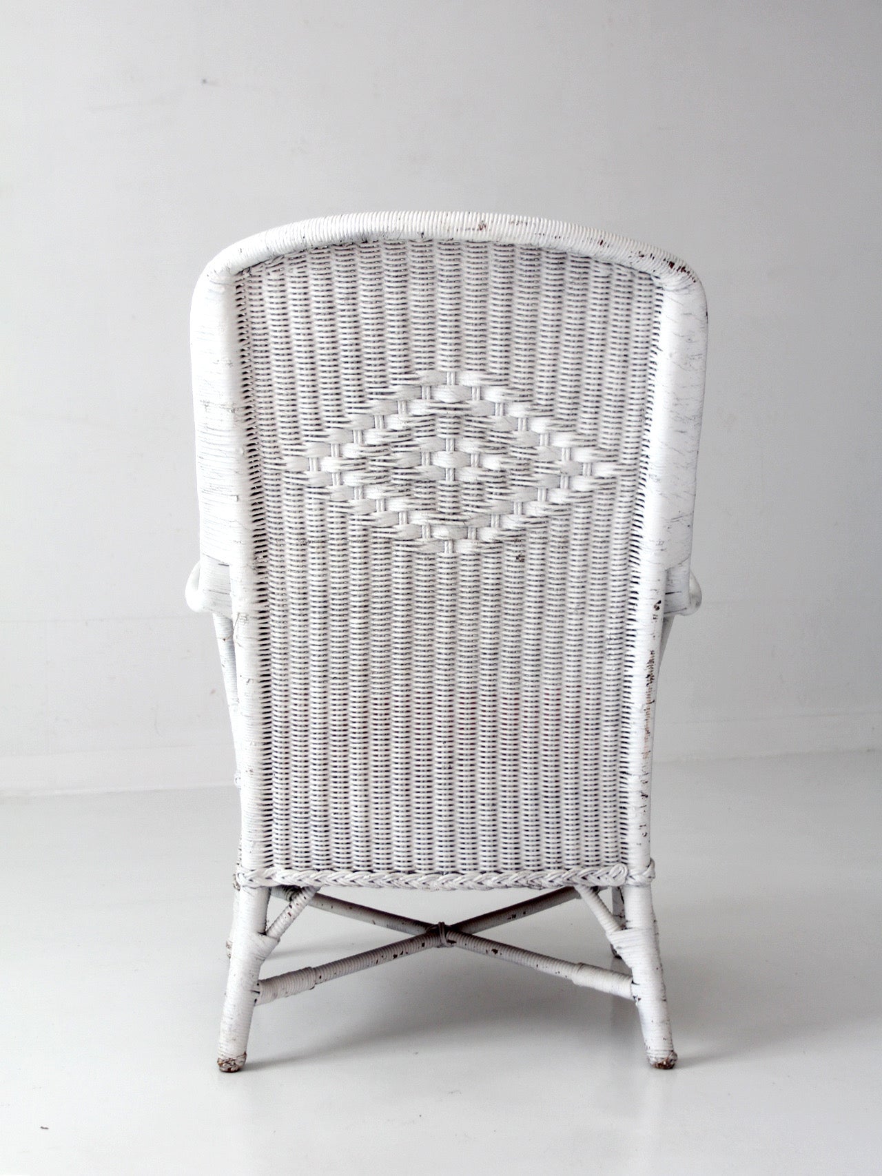 antique white wicker porch chair