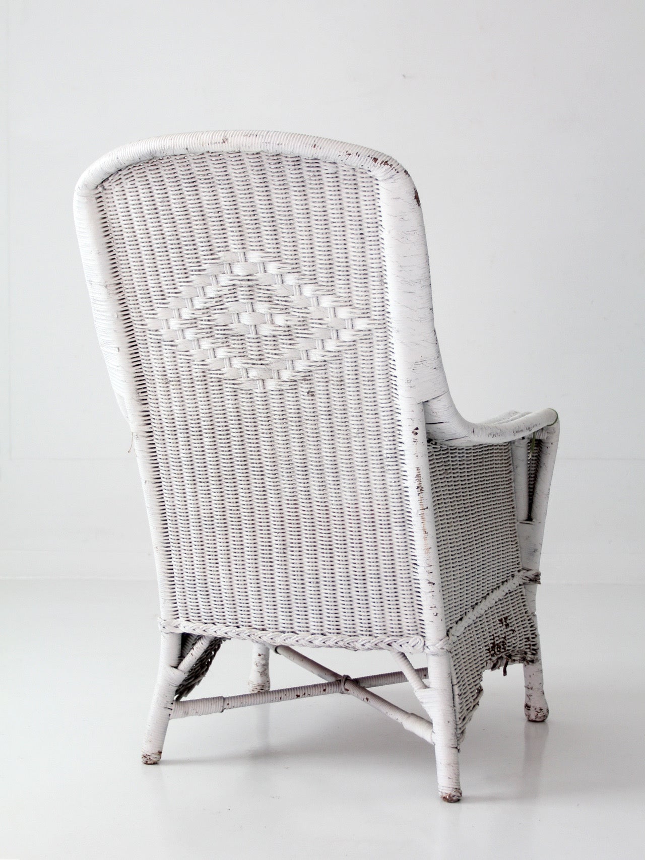 antique white wicker porch chair