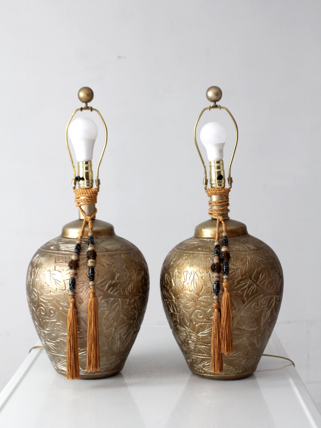 pair of vintage Chinoiserie style gilt ceramic table lamps