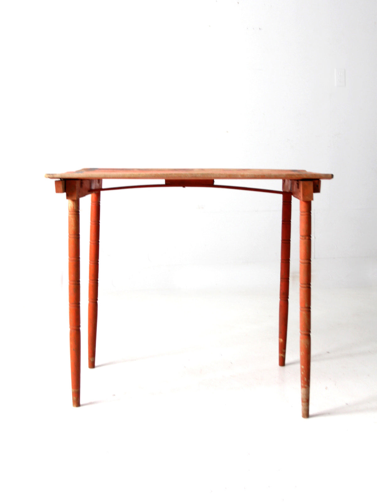 antique orange painted wood clipper folding table