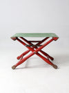 vintage red and green x-frame camp stool