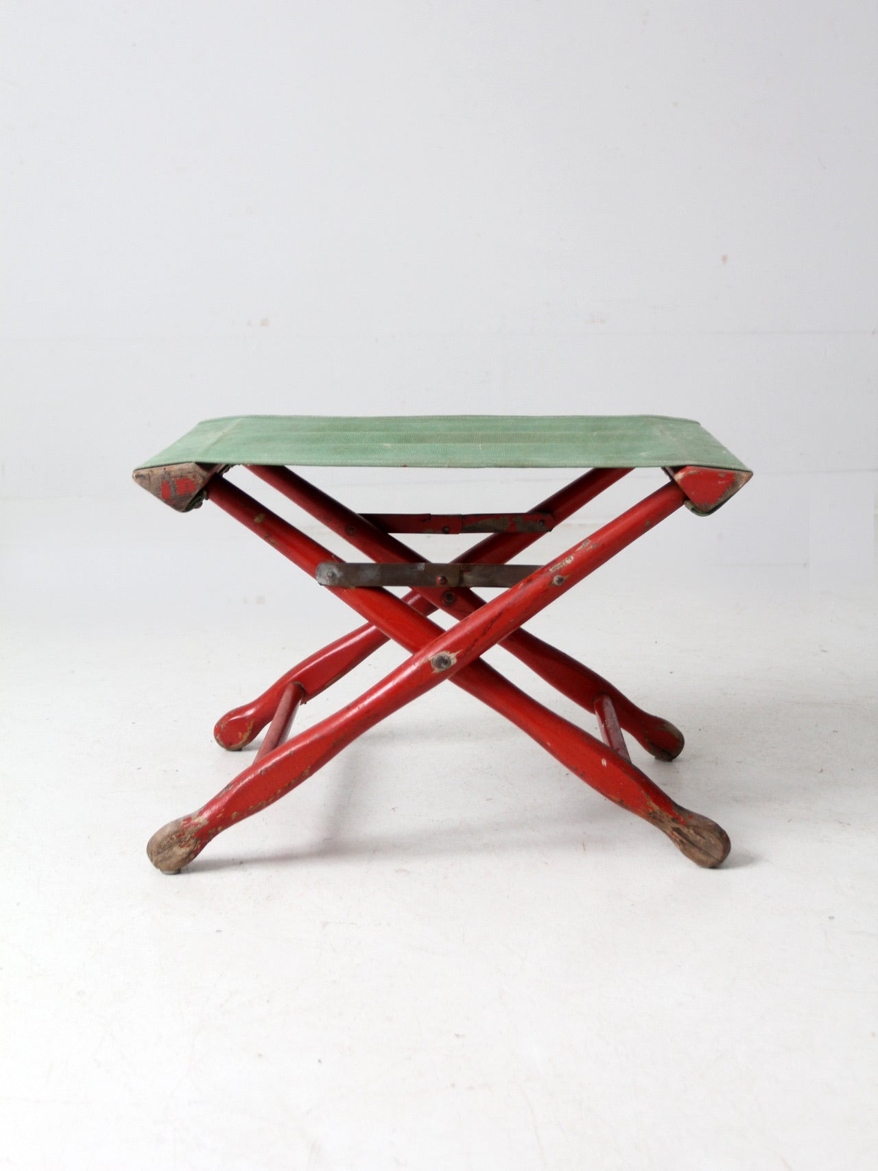 vintage red and green x-frame camp stool