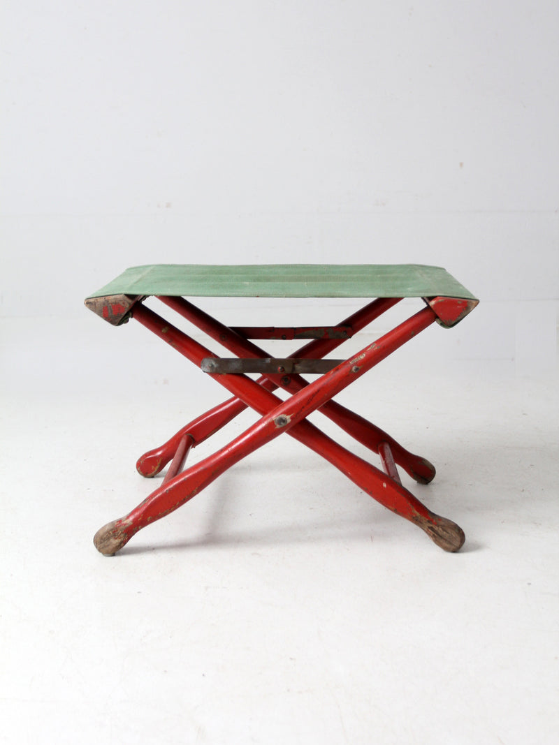 vintage red and green x-frame camp stool