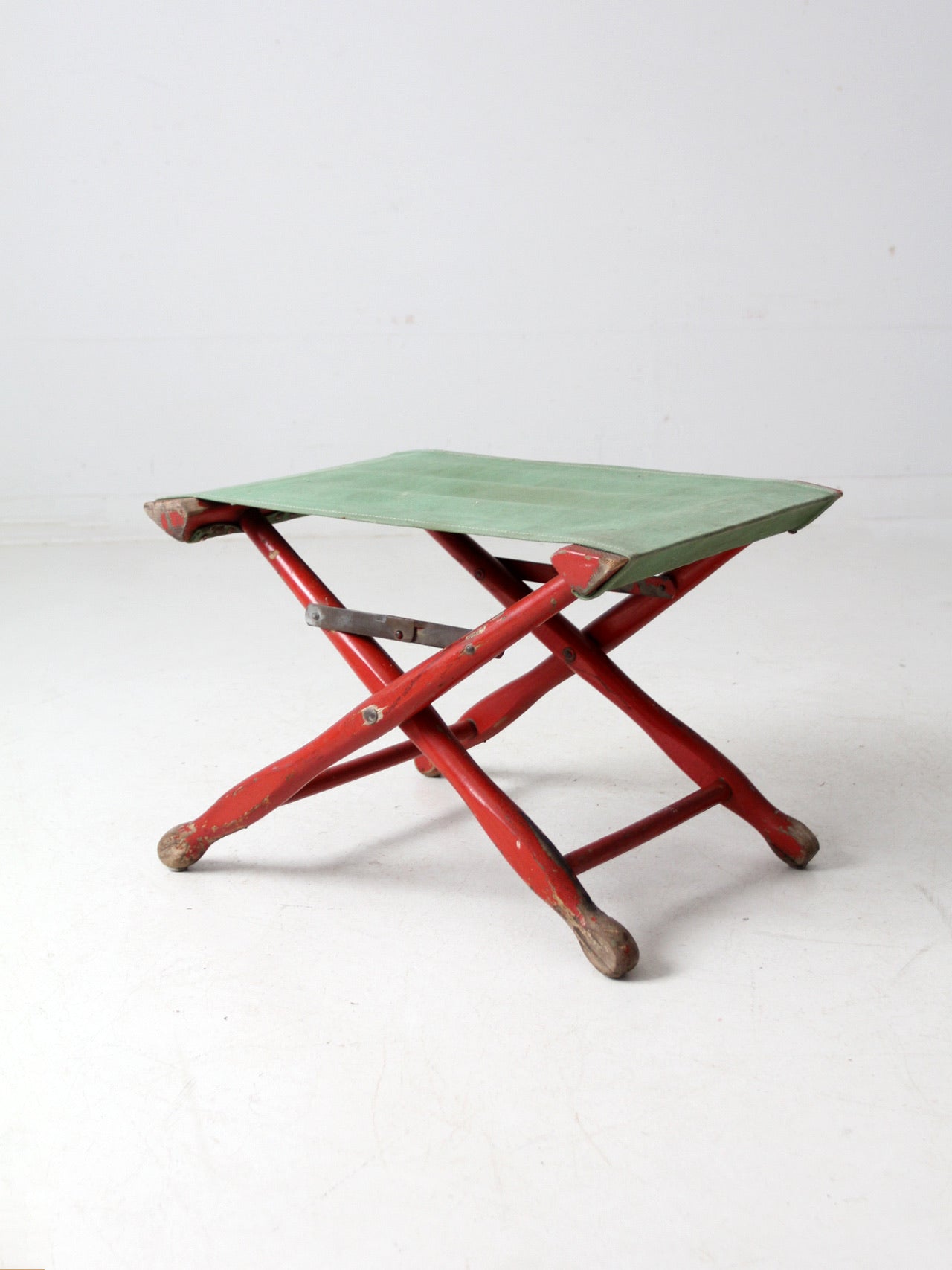 vintage red and green x-frame camp stool
