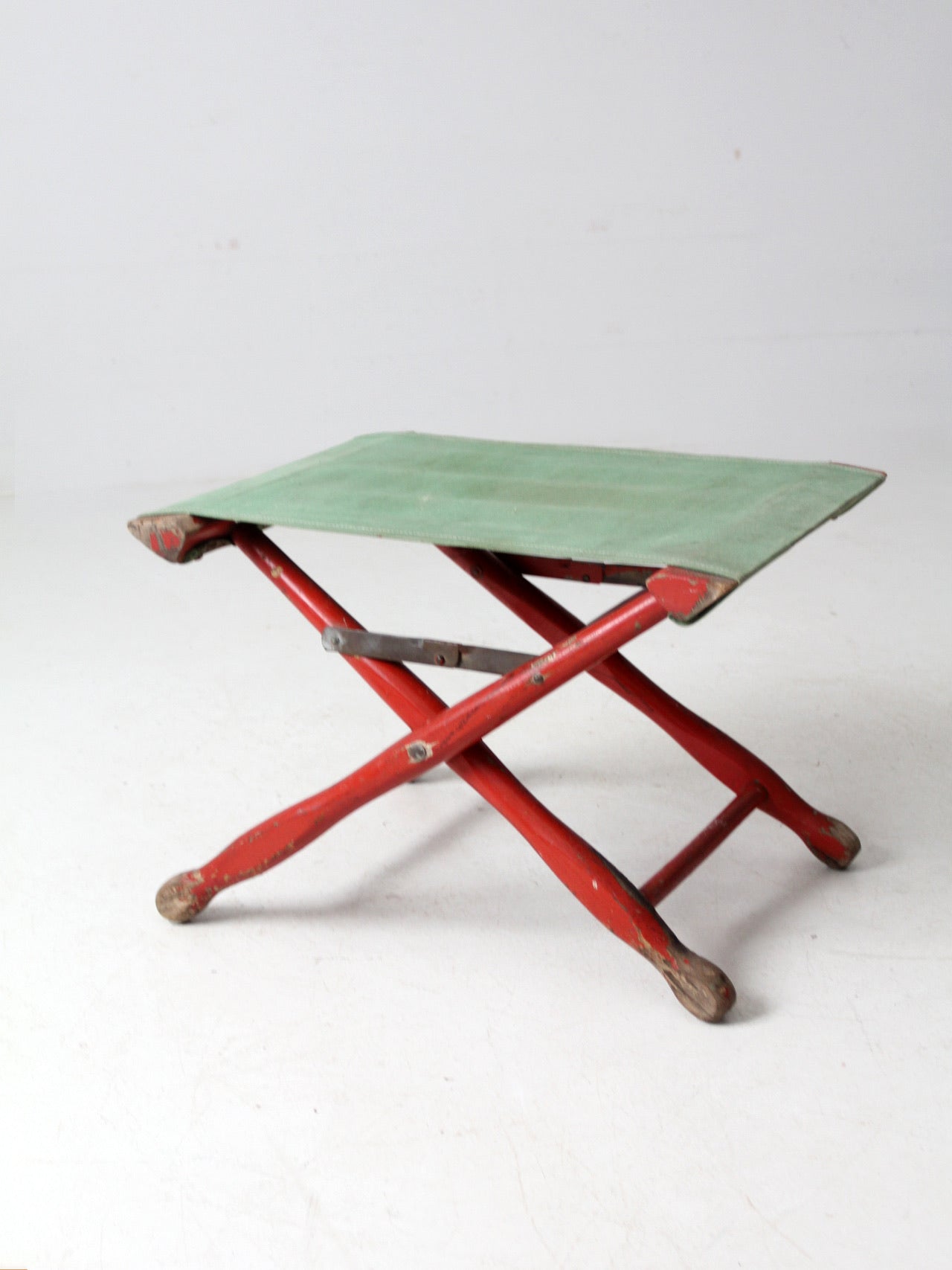 vintage red and green x-frame camp stool