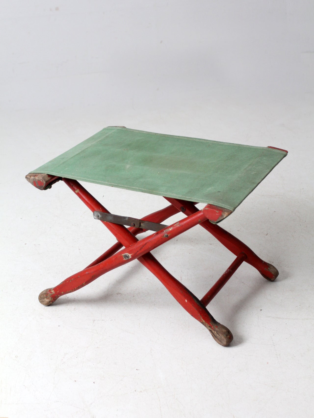 vintage red and green x-frame camp stool