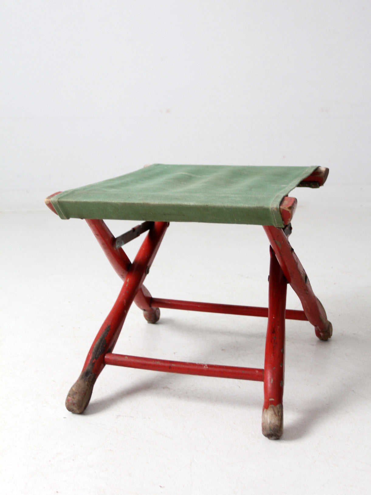 vintage red and green x-frame camp stool