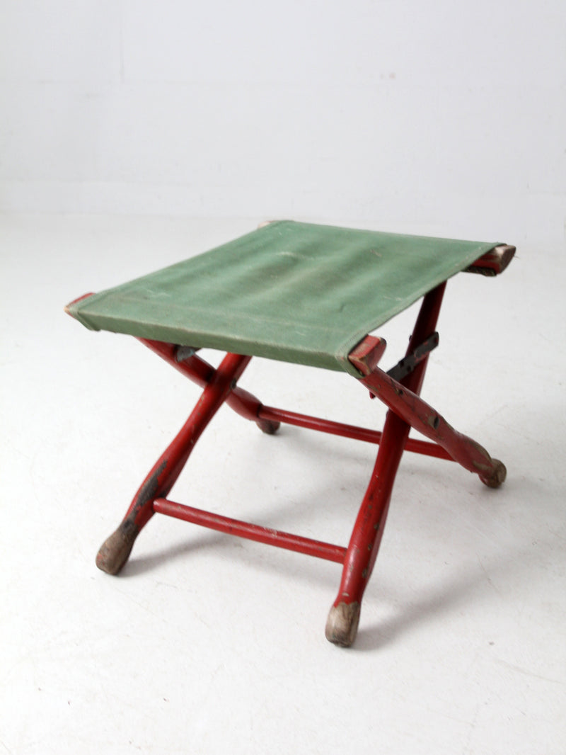 vintage red and green x-frame camp stool