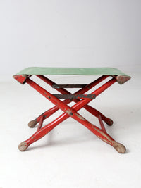 vintage red and green x-frame camp stool