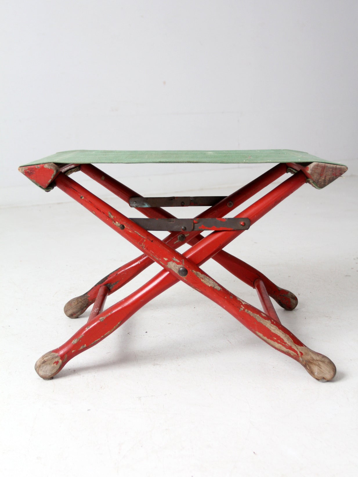 vintage red and green x-frame camp stool