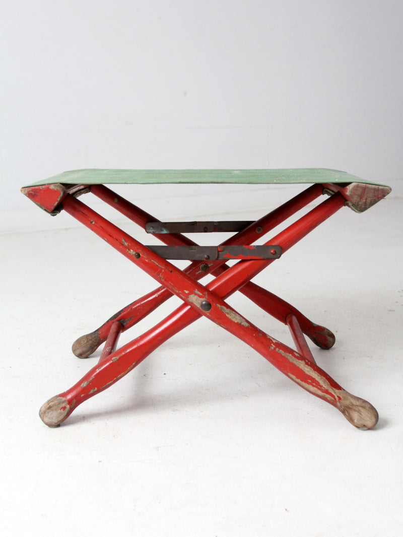 vintage red and green x-frame camp stool