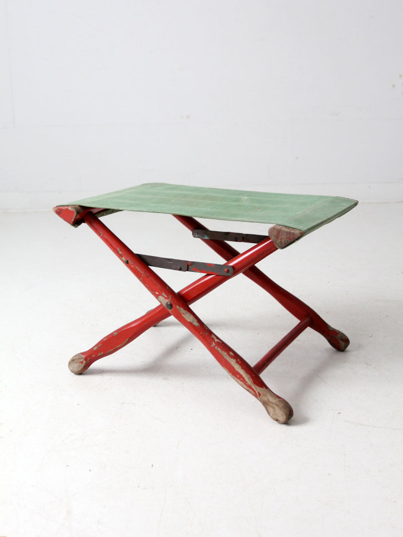 vintage red and green x-frame camp stool