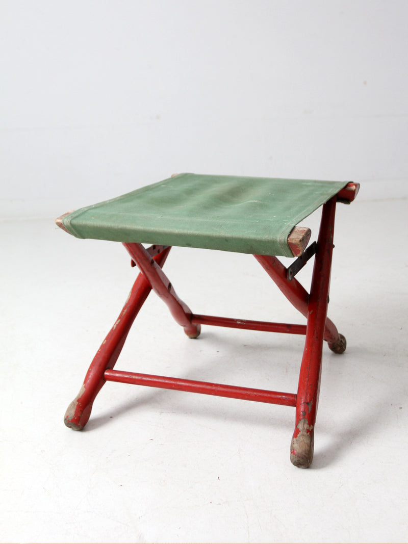 vintage red and green x-frame camp stool