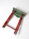 vintage red and green x-frame camp stool