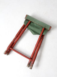 vintage red and green x-frame camp stool