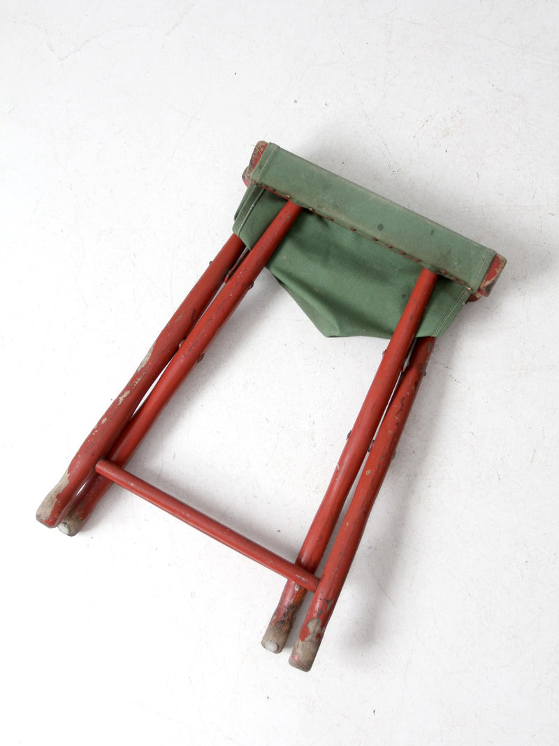 vintage red and green x-frame camp stool