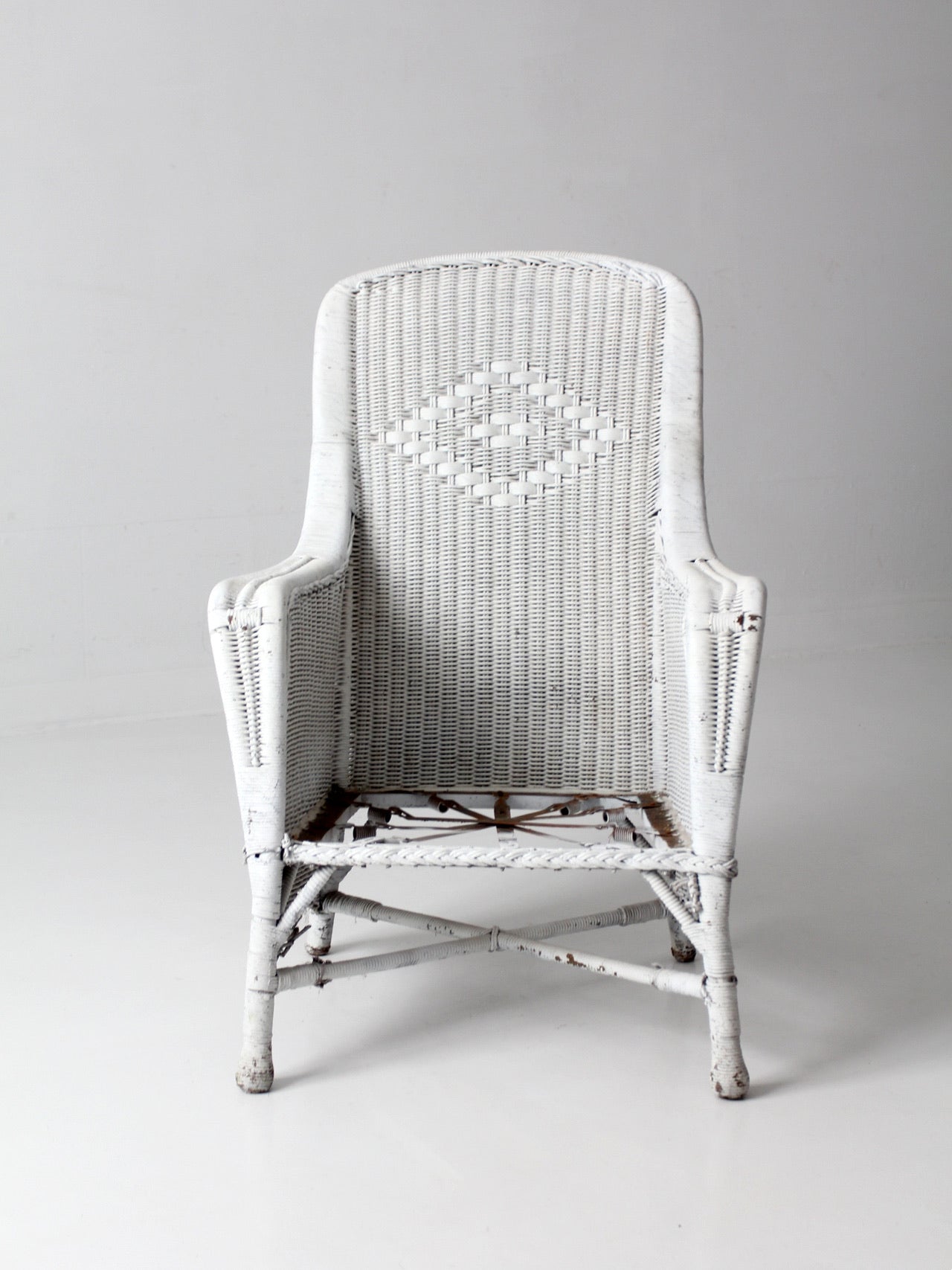 antique white wicker porch chair