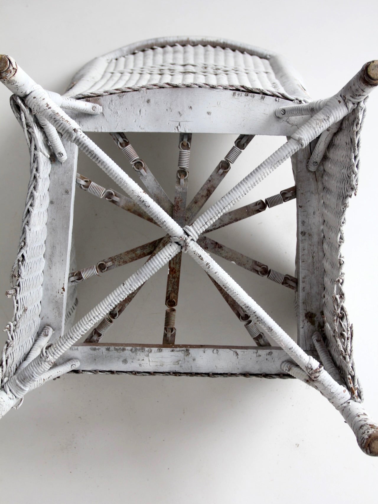 antique white wicker porch chair