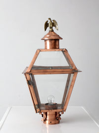 vintage copper lantern light fixture with brass eagle finial