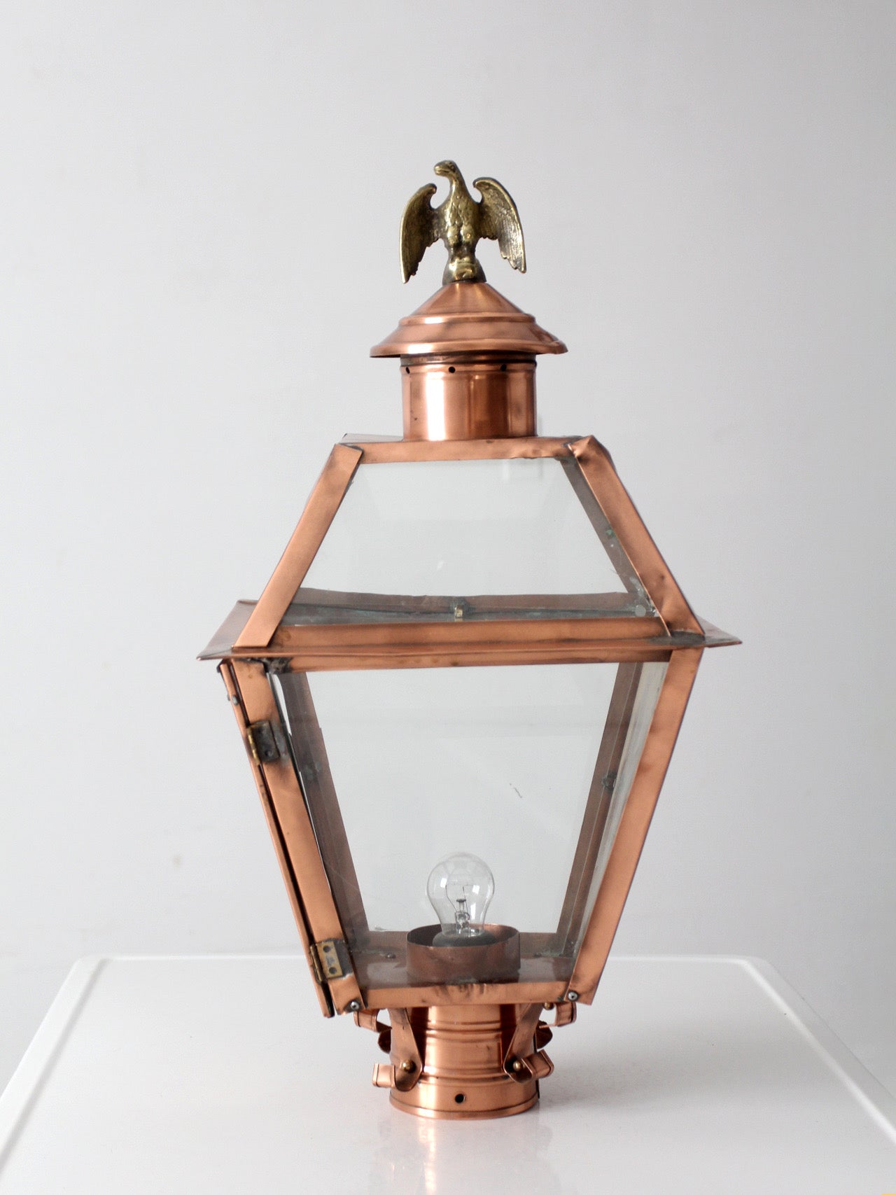 vintage copper lantern light fixture with brass eagle finial