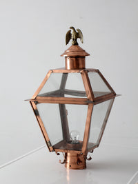 vintage copper lantern light fixture with brass eagle finial