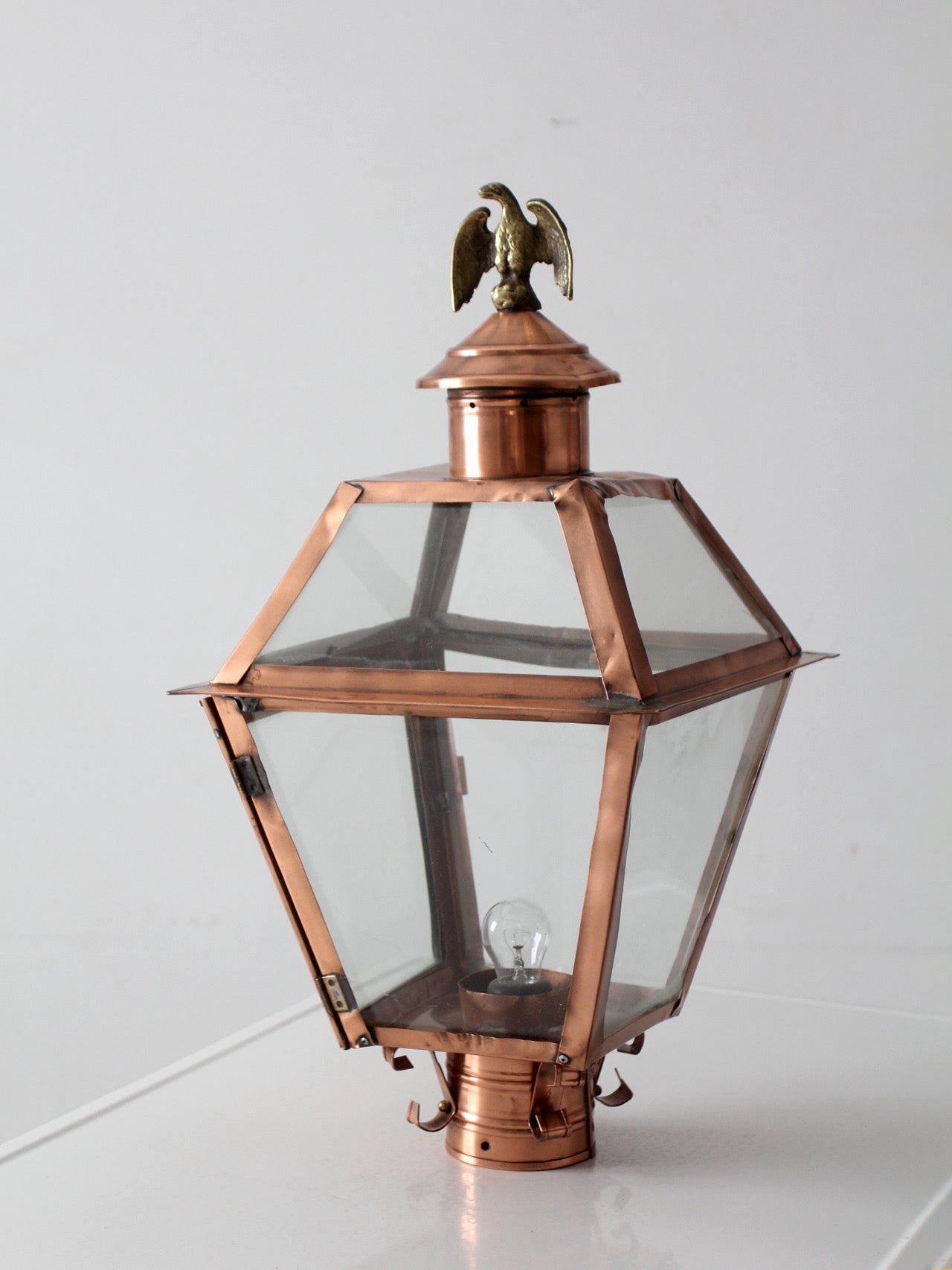 vintage copper lantern light fixture with brass eagle finial