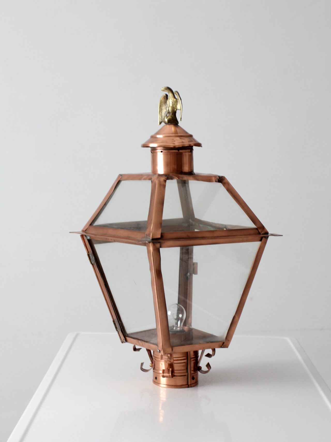 vintage copper lantern light fixture with brass eagle finial