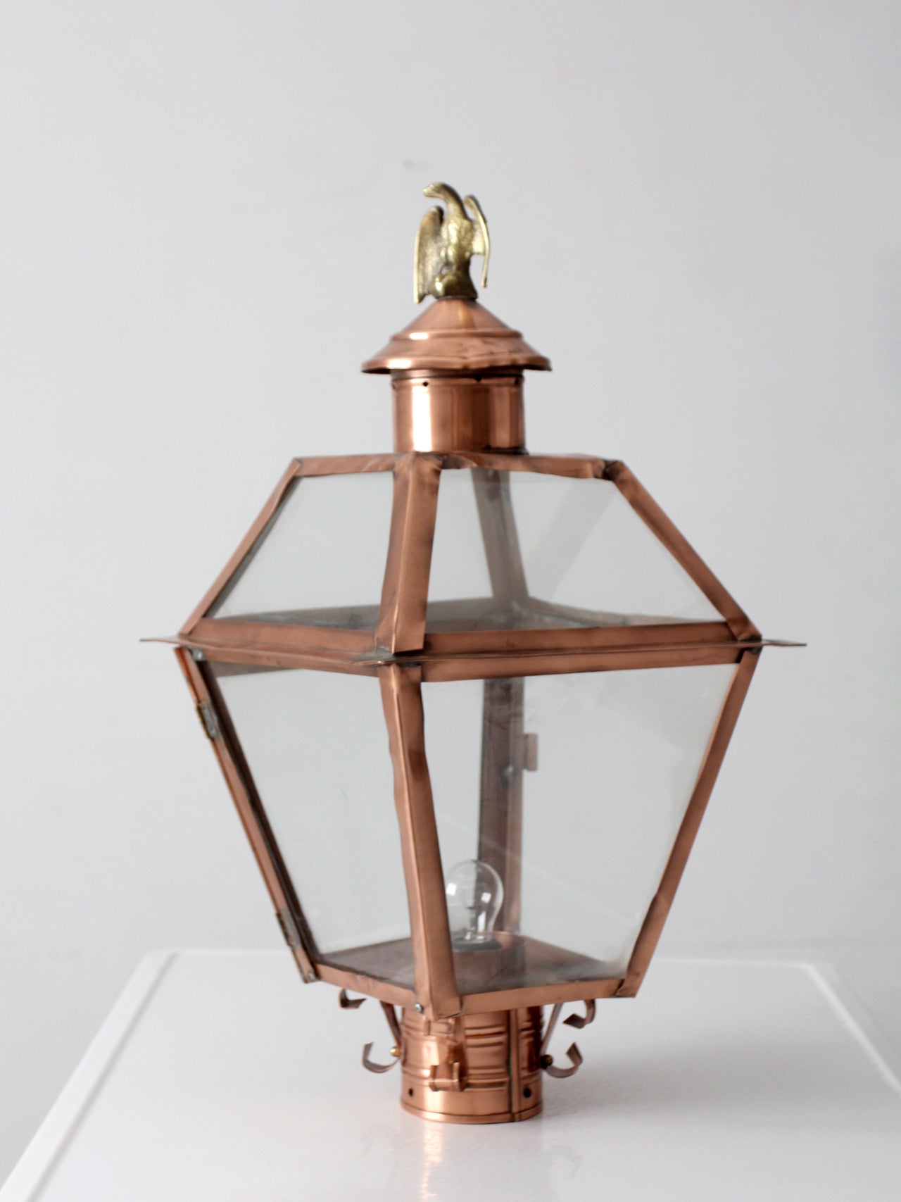 vintage copper lantern light fixture with brass eagle finial