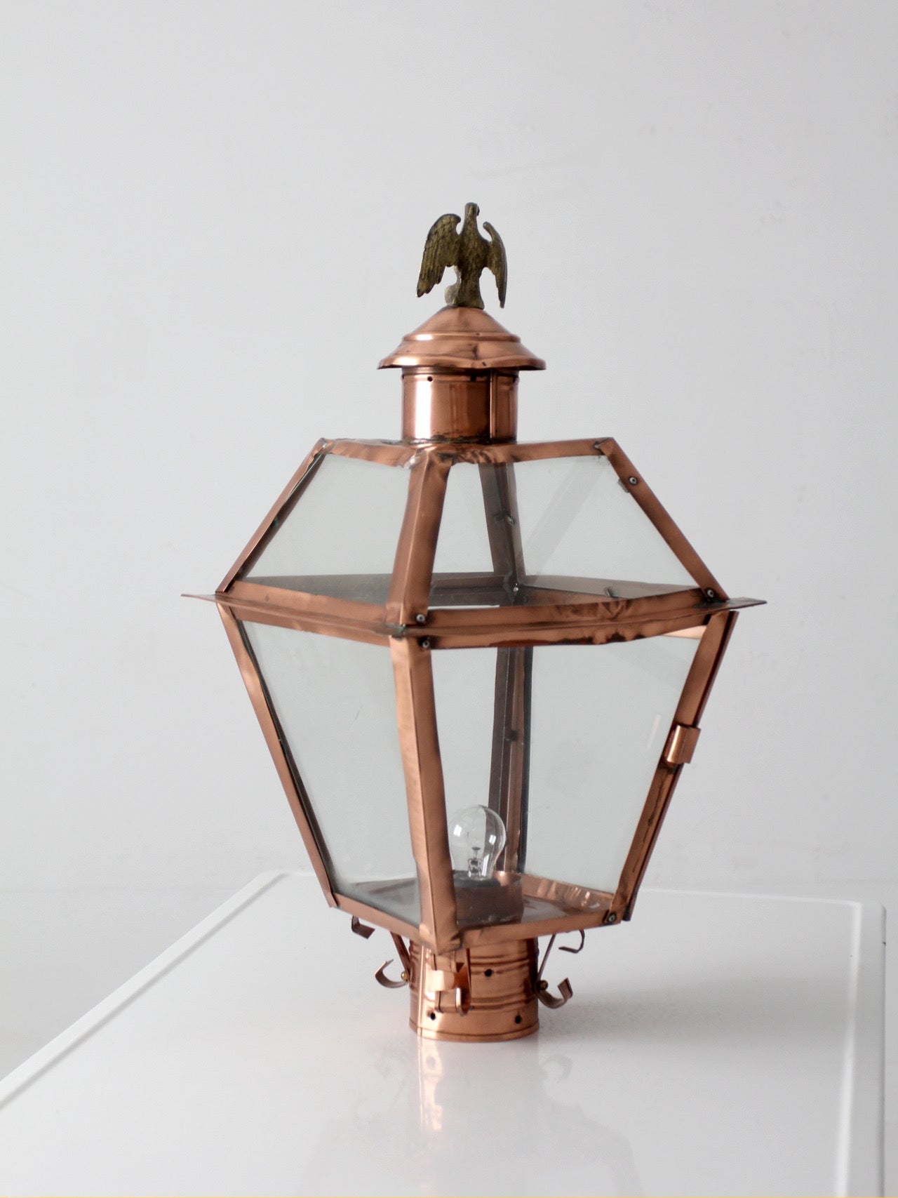 vintage copper lantern light fixture with brass eagle finial