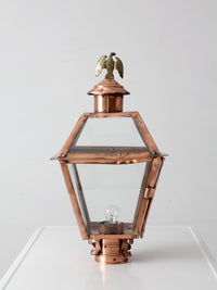 vintage copper lantern light fixture with brass eagle finial